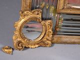 a mirror that is sitting on the floor next to a mirror