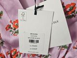 the label on a dress is attached to the neck of the dress