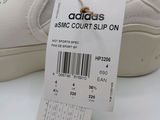 a white shoe that has a price tag on it