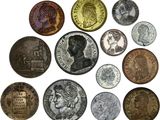 a close up of a bunch of coins on a white surface