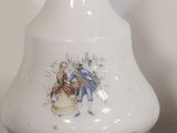 a white vase with a picture of a man and woman on it