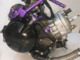 a motorcycle that is sitting on a table with a hose