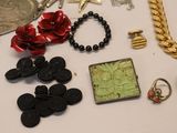 a lot of jewelry sitting on a table together