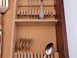 a drawer that has a set of silverware in it