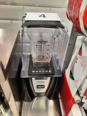 a blender that is sitting on a counter in a kitchen