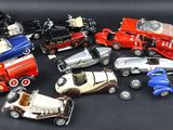 a lot of toy cars that are sitting on a table
