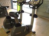 two stationary exercise bikes in a gym room