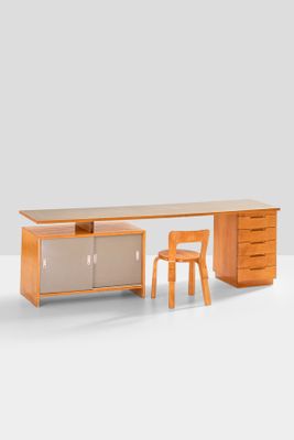an image of a desk with a chair and a desk top