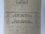 an old book with a drawing of a building on it