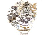 a pile of jewelry on a white surface