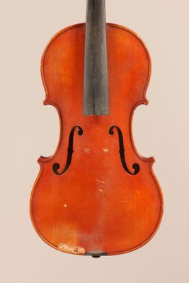 an old violin with a bow hanging from it ' s back