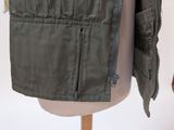 an image of a jacket on a mannequin dummy with a zipper