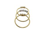 a close up of three gold rings on a white background