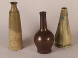 three vases sitting next to each other on a table