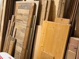 many pieces of wood stacked on top of each other
