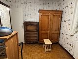 an image of a room with a wooden floor and a skylight