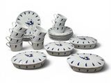 a lot of plates and cups on a white table