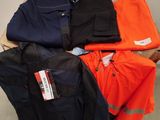 a pile of men ' s work clothes sitting on top of each other