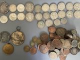 a lot of coins that are on the table