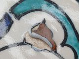a close up of a blue and white plate with a horse on it