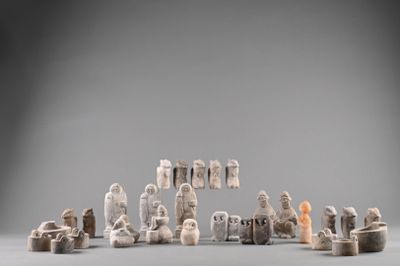 an image of a group of figurines sitting on top of a table