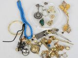 a lot of jewelry on a white surface