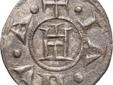 a close up of a coin with an image of a building on it