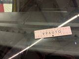 a close up of a sticker on the dashboard of a car