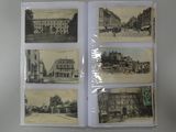 four old postcards of different buildings on a table