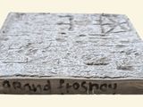 a stone block with writing on it that says ground poshy
