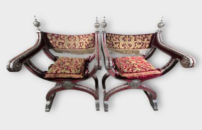 pair of chairs with red and gold cushions on them on a white background