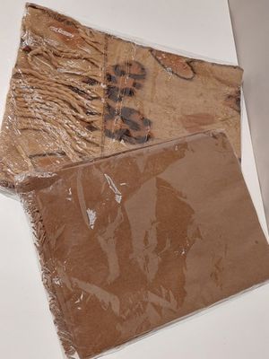 two pieces of paper that are wrapped in plastic