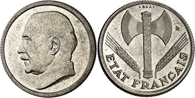 an image of a coin with a man ' s head and a hammer on it