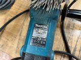 a close up of a blue and black brush on a table