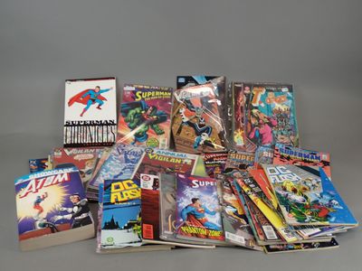 a lot of comic books sitting on a table