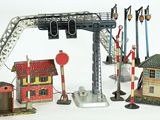 a lot of toy trains and buildings on a white surface