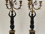 pair of antique brass and bronze candelabs with angels on them