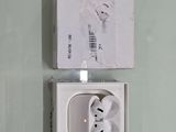 a white box with a pair of earphones in it