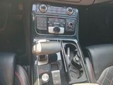 a close up of a car ' s gear box and dashboard
