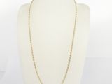 a gold chain necklace on a mannequin mannequin mannequin mannequin mannequin mannequin mannequin mannequin manne