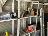 a room with a shelf full of tools and supplies