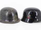 pair of black helmets sitting on top of each other on a white surface