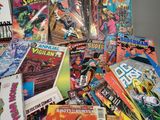 a pile of comic books and comics on a table