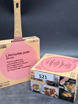 packaging of a wooden spatula next to a cardboard box of food