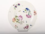 a white plate with a floral design on it