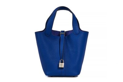 a blue handbag on a white background