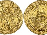 a gold coin with an image of a man holding a sword