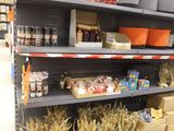 many shelves with various items on them in a store