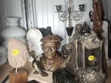 a lot of antiques on a table in a room