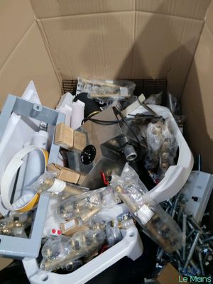 a cardboard box filled with a toilet and other items
